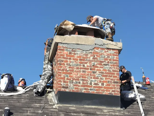 Aurora Chimney Sweep installing a custom chimney crown in Aurora, OH