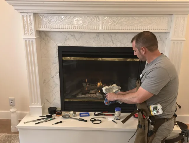 Aurora Chimney Sweep performing fireplace maintenance in Aurora, OH